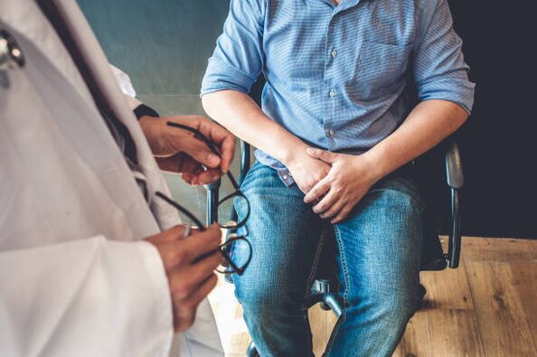 a man with symptoms of prostatitis at a doctor's appointment